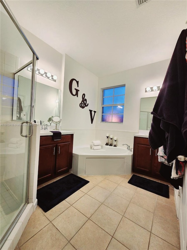 bathroom with separate shower and tub, tile patterned floors, and vanity