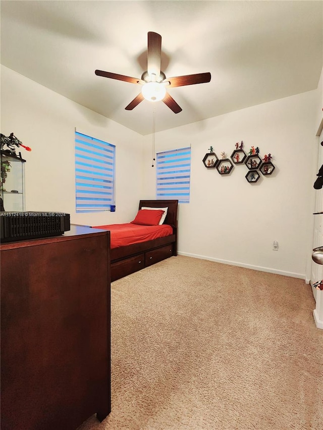 carpeted bedroom featuring ceiling fan