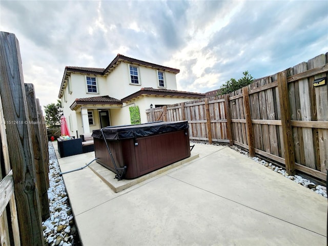 view of patio / terrace featuring a hot tub