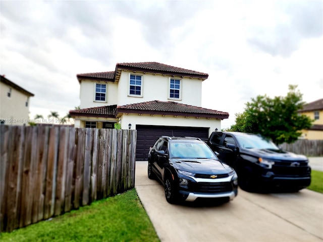 mediterranean / spanish-style home featuring a garage