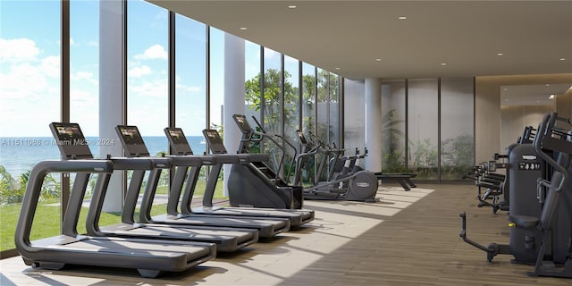 workout area with a water view and floor to ceiling windows