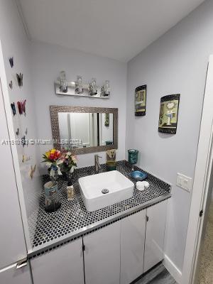 bathroom with vanity with extensive cabinet space