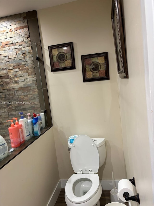 bathroom featuring toilet and hardwood / wood-style floors