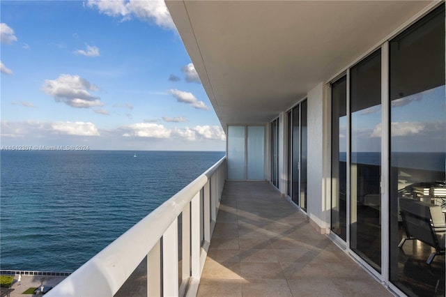 balcony featuring a water view