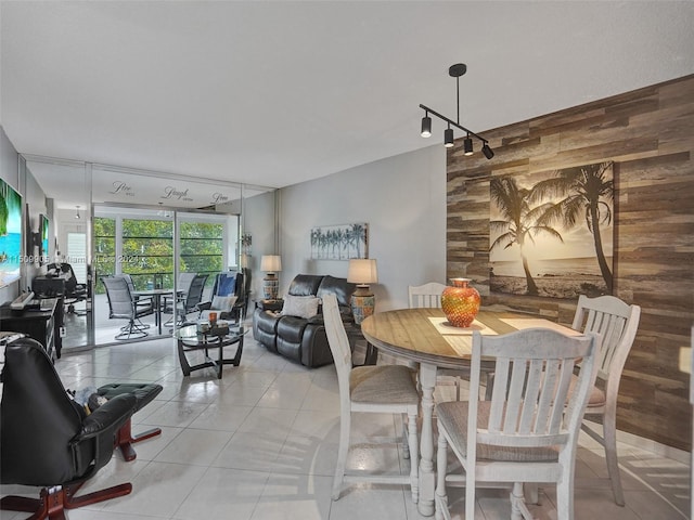 tiled dining area with rail lighting and wooden walls