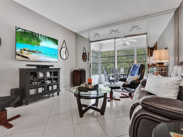 living room with light tile patterned flooring and ceiling fan