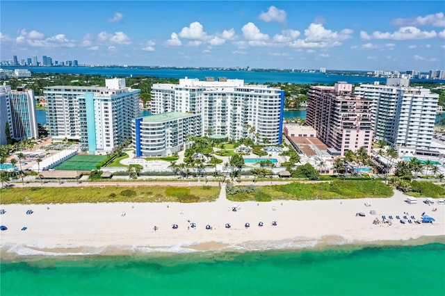 bird's eye view featuring a view of the beach and a water view