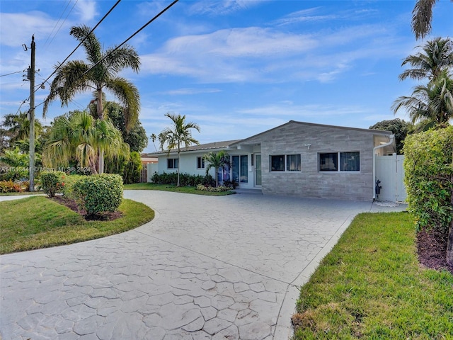 ranch-style home with a front yard