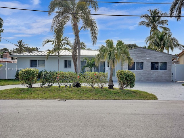 ranch-style house with a front lawn