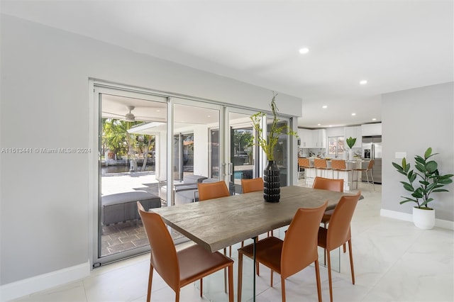 dining area featuring a healthy amount of sunlight and ceiling fan