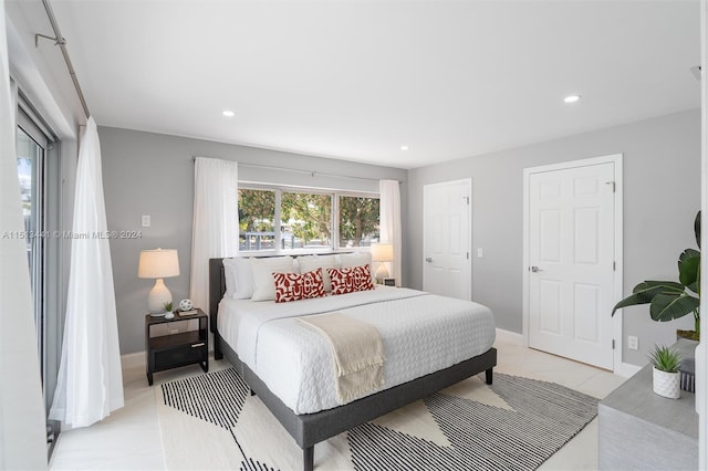 bedroom featuring light tile patterned flooring