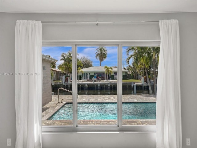 doorway to outside featuring a water view