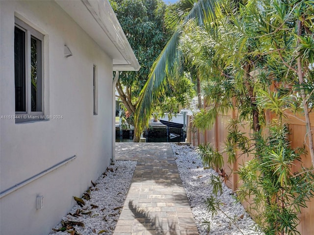 view of property exterior with a patio area