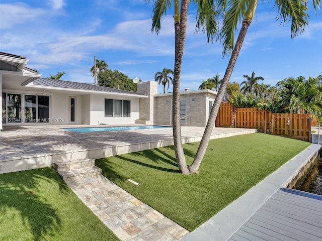 view of yard featuring a patio and a fenced in pool