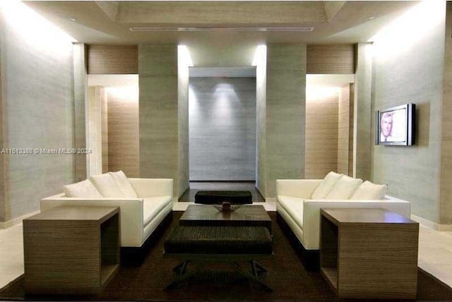 bathroom with a raised ceiling and tile floors