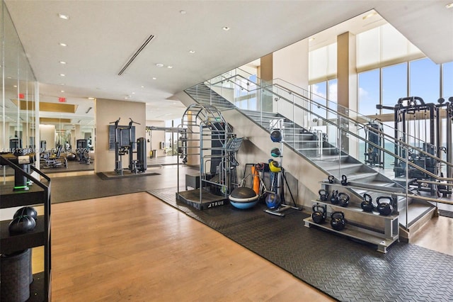 workout area featuring hardwood / wood-style floors