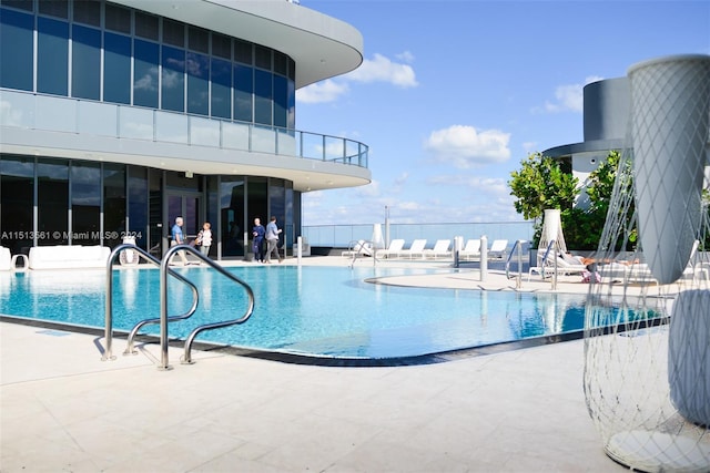 view of swimming pool featuring a patio