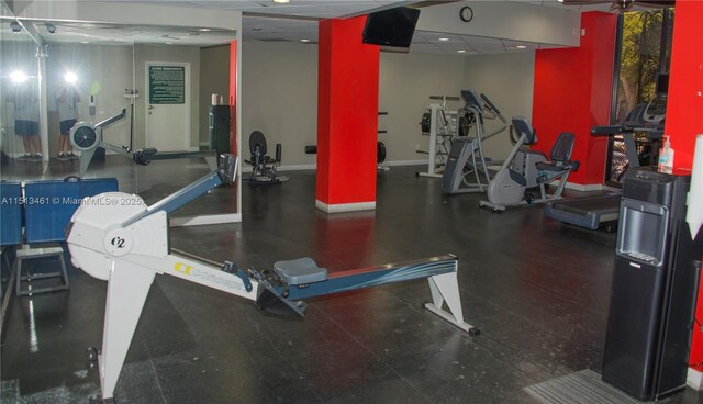 exercise room featuring a drop ceiling