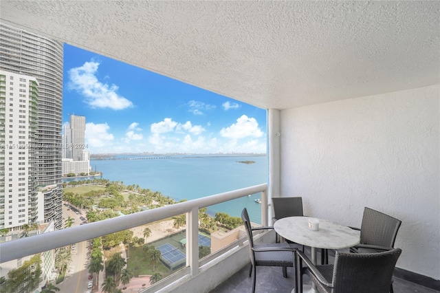 balcony featuring a water view