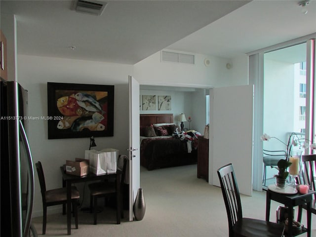 dining space with light carpet