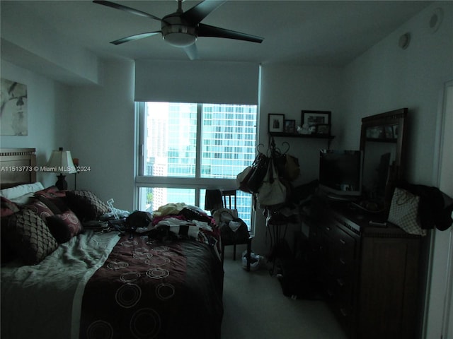 bedroom with ceiling fan and carpet floors