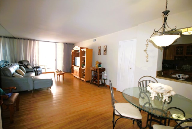 dining room with hardwood / wood-style floors