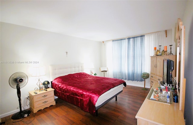 bedroom featuring dark hardwood / wood-style flooring