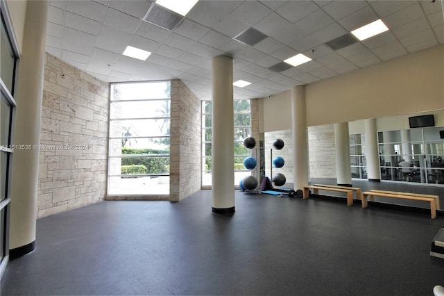 gym featuring a paneled ceiling