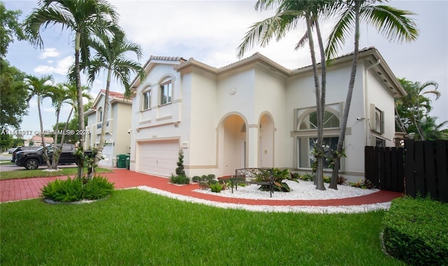 view of front facade with a front lawn and a garage