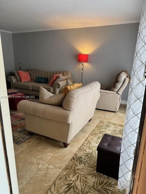 living room featuring light tile patterned floors and ornamental molding