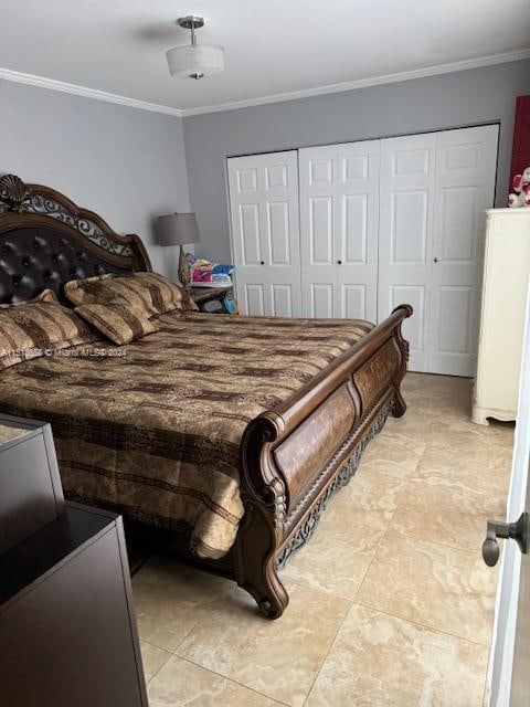 bedroom with light tile patterned flooring, a closet, and crown molding