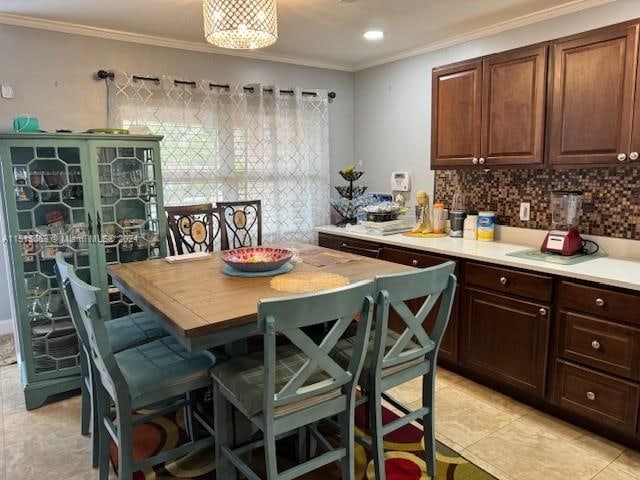 kitchen with ornamental molding and backsplash