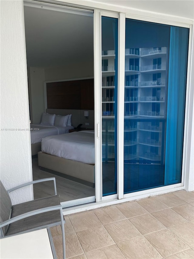 bedroom featuring light tile floors