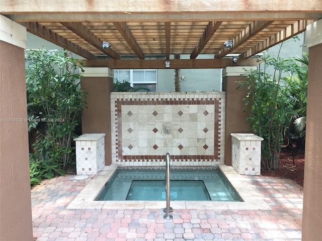 view of pool featuring a community hot tub