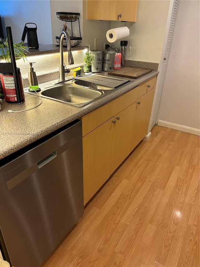 kitchen featuring sink, light brown cabinets, dishwasher, and light wood-type flooring