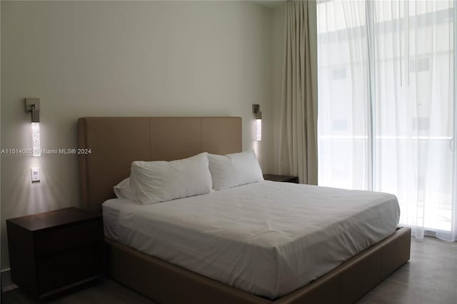 bedroom featuring dark wood-type flooring