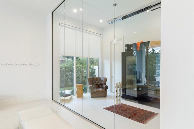 interior space featuring a wealth of natural light and light tile patterned floors