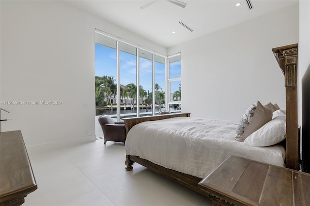 bedroom featuring a water view