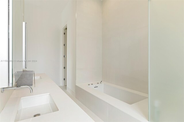 bathroom featuring vanity and a bathing tub