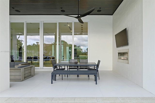 exterior space featuring ceiling fan