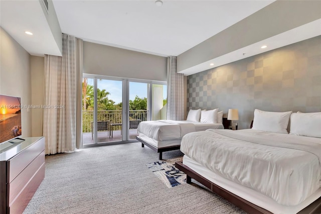 carpeted bedroom featuring access to exterior