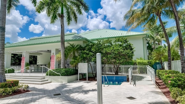 rear view of property featuring a patio area