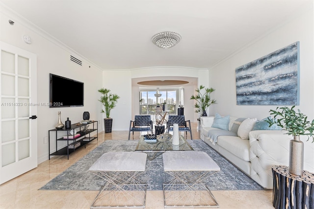 living room with ornamental molding and tile patterned floors