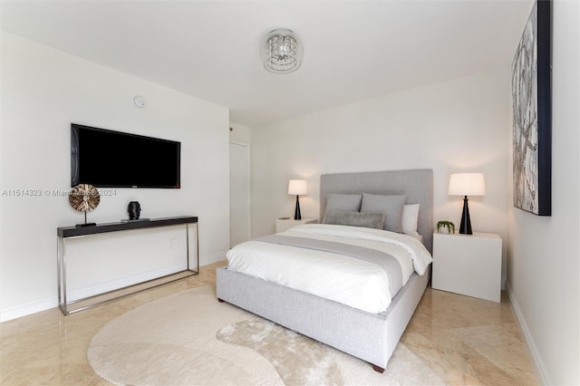 bedroom featuring light tile patterned flooring