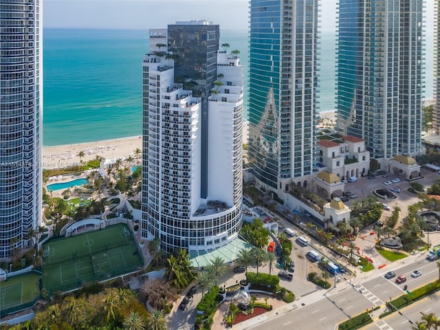 bird's eye view featuring a beach view and a water view