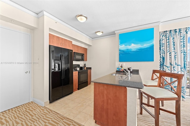 kitchen featuring black appliances, crown molding, sink, light tile patterned floors, and kitchen peninsula