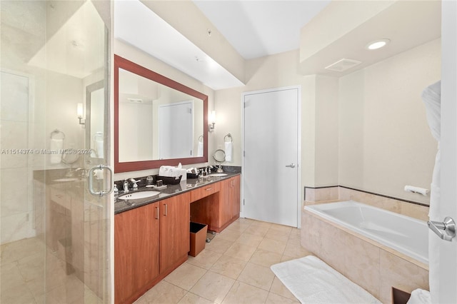 bathroom featuring tile patterned flooring, vanity, and separate shower and tub