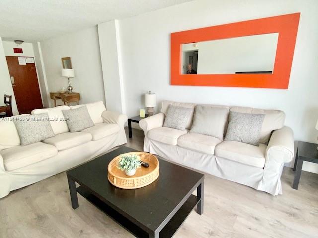 living room with wood-type flooring