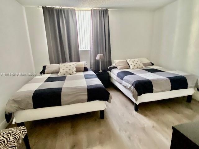 bedroom featuring wood-type flooring