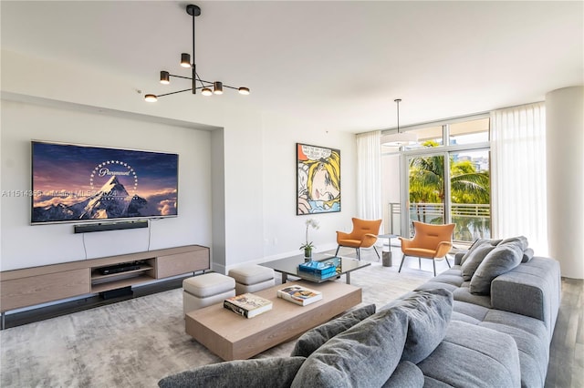 living room with a wall of windows and a chandelier